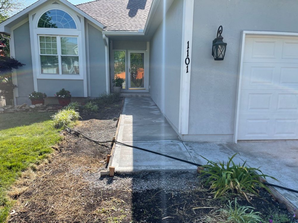 Residential concrete front walkway installation in Kansas City, MO